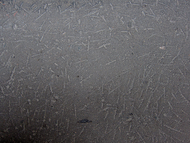 18_Scratches_on_the_pavement_in_Moscow_from_picks_clearing_ice_after_winter.jpg
